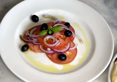 Tomato, onion and olive salad at Mamma Mia